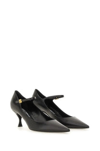 Dolce &amp; Gabbana women’s black leather mary jane pumps with gold-tone buckle and slender heel