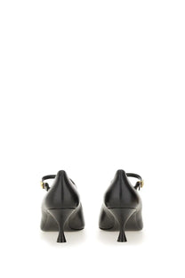Dolce &amp; Gabbana women’s black leather mary jane heels with gold tone buckle details and classic pump design