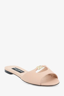 Beige leather Dolce &amp; Gabbana women’s slide sandal with gold-tone DG logo clasp