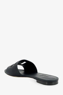 Dolce &amp; gabbana women’s black leather slide sandal with minimalist design and subtle logo on the strap