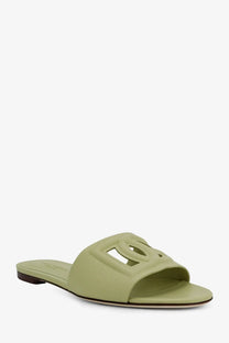 Dolce &amp; Gabbana women’s leather slide sandal in light green with a prominent cut-out logo detail
