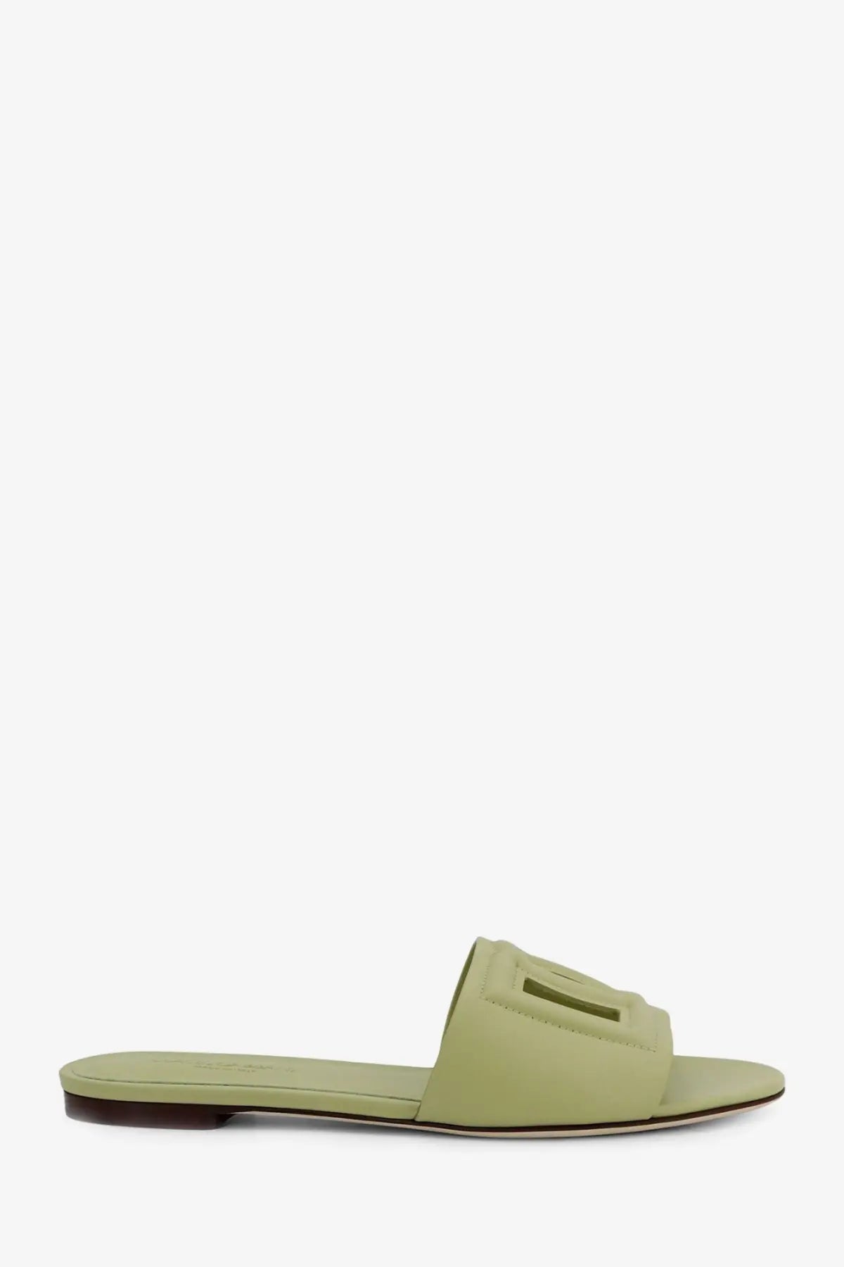 Dolce &amp; Gabbana women’s light green suede slide sandal with minimalist design and dark brown leather sole
