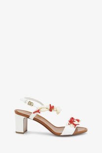 Dolce and Gabbana women’s white leather sandals with red and cream coral-inspired embellishments and gold buckle