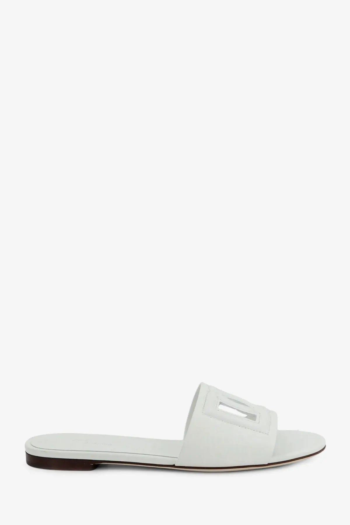 Dolce &amp; Gabbana women’s white leather slide sandal with minimalist design and rectangular cutout detail on strap