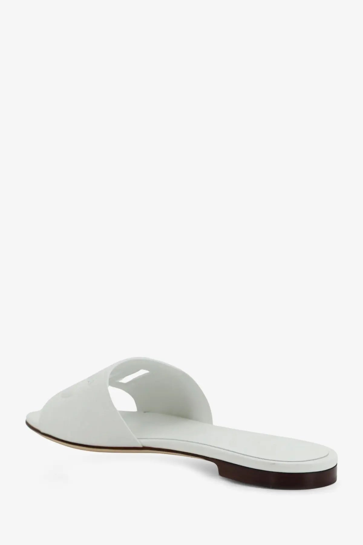 Dolce &amp; Gabbana women’s leather slide sandal in white with minimalist design and dark brown sole