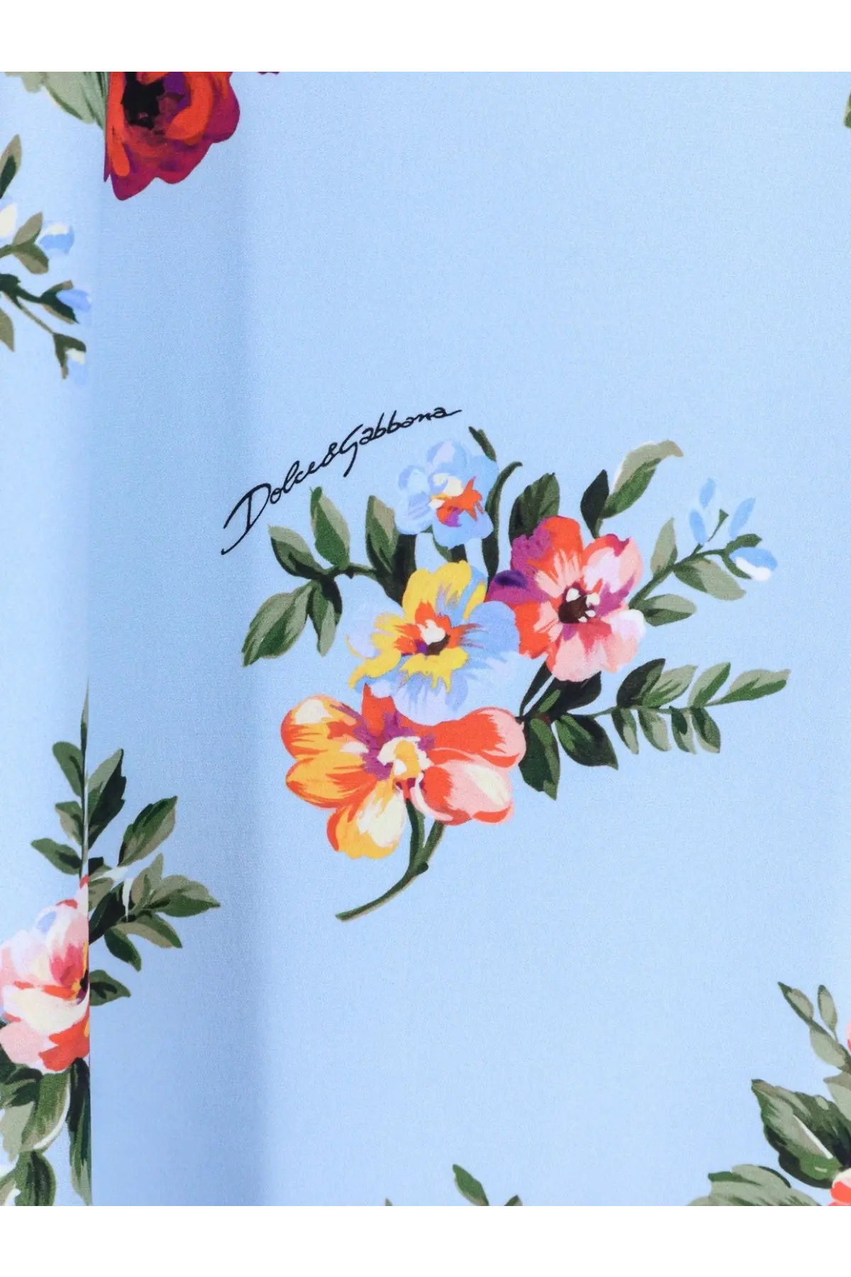 Dolce &amp; Gabbana women’s long charmeuse dress in light blue with vibrant floral print and green leaf accents