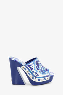 Dolce &amp; Gabbana women’s blue shiny leather mule sandal with white and lighter blue patterns and silver studs on the side