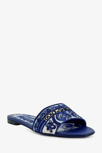 Blue dolce &amp; gabbana womens maiolica slide sandal with intricate white and navy patterned strap