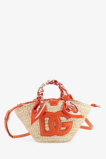 Dolce and Gabbana women’s maiolica shoulder bag in orange leather and cream raffia with woven dg logo and fabric tied handles