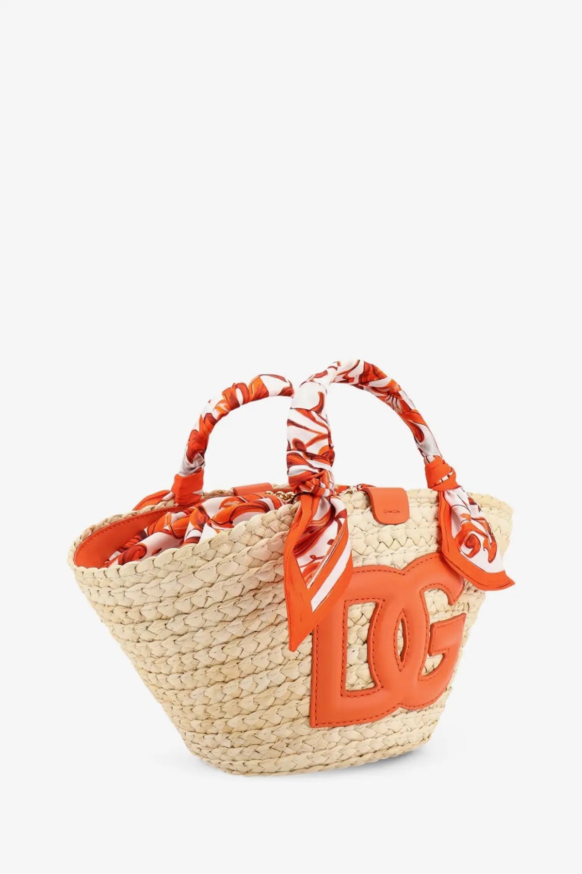 Beige woven straw tote bag with orange leather dolce and gabbana logo and matching patterned scarf handles