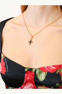 Dolce &amp; Gabbana women’s gold metal chain necklace with a small black cross pendant