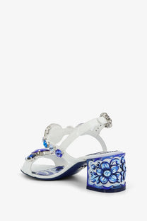 Dolce &amp; Gabbana women’s patent leather sandal in blue with white ceramic block heel and sparkling blue gemstone floral design