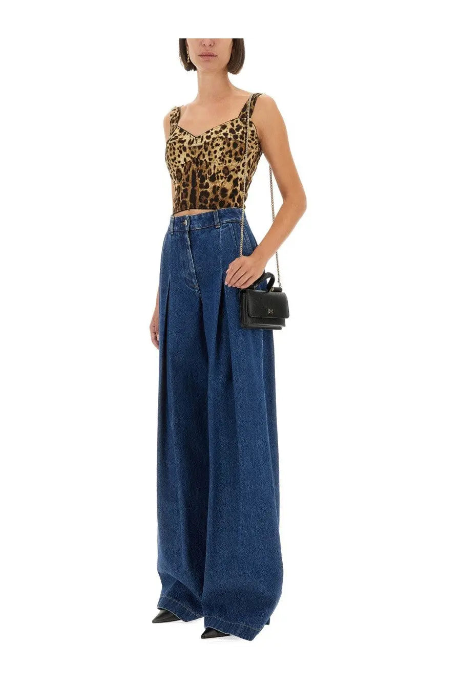 Black mini crossbody bag with chain strap paired with dolce and gabbana womens pocket denim pants blue