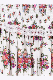 Dolce &amp; Gabbana women’s white poplin dress with colorful floral print smocked bodice and lace waist trim
