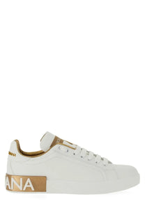 Dolce and gabbana women’s portofino white leather sneaker with gold-tone branding on heel and side shown from back