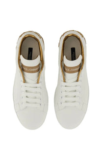 Dolce &amp; Gabbana women’s Portofino white leather sneakers with gold-tone accents and branding