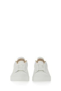 Dolce &amp; Gabbana women’s Portofino white leather sneakers with gold-tone branding on the heel tab back side view