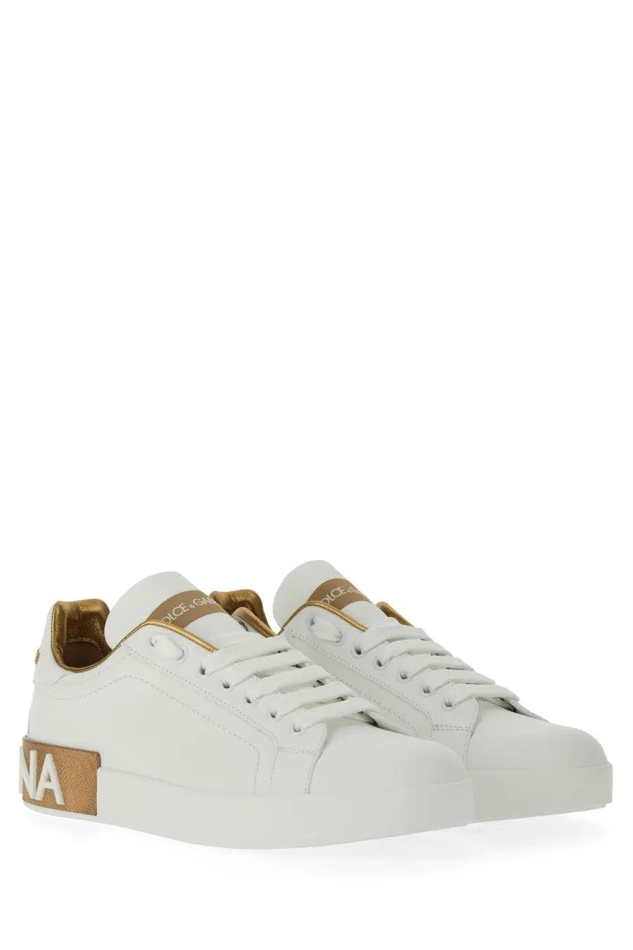 Dolce &amp; Gabbana women’s Portofino white leather sneakers with gold-tone branding and heel tab accents