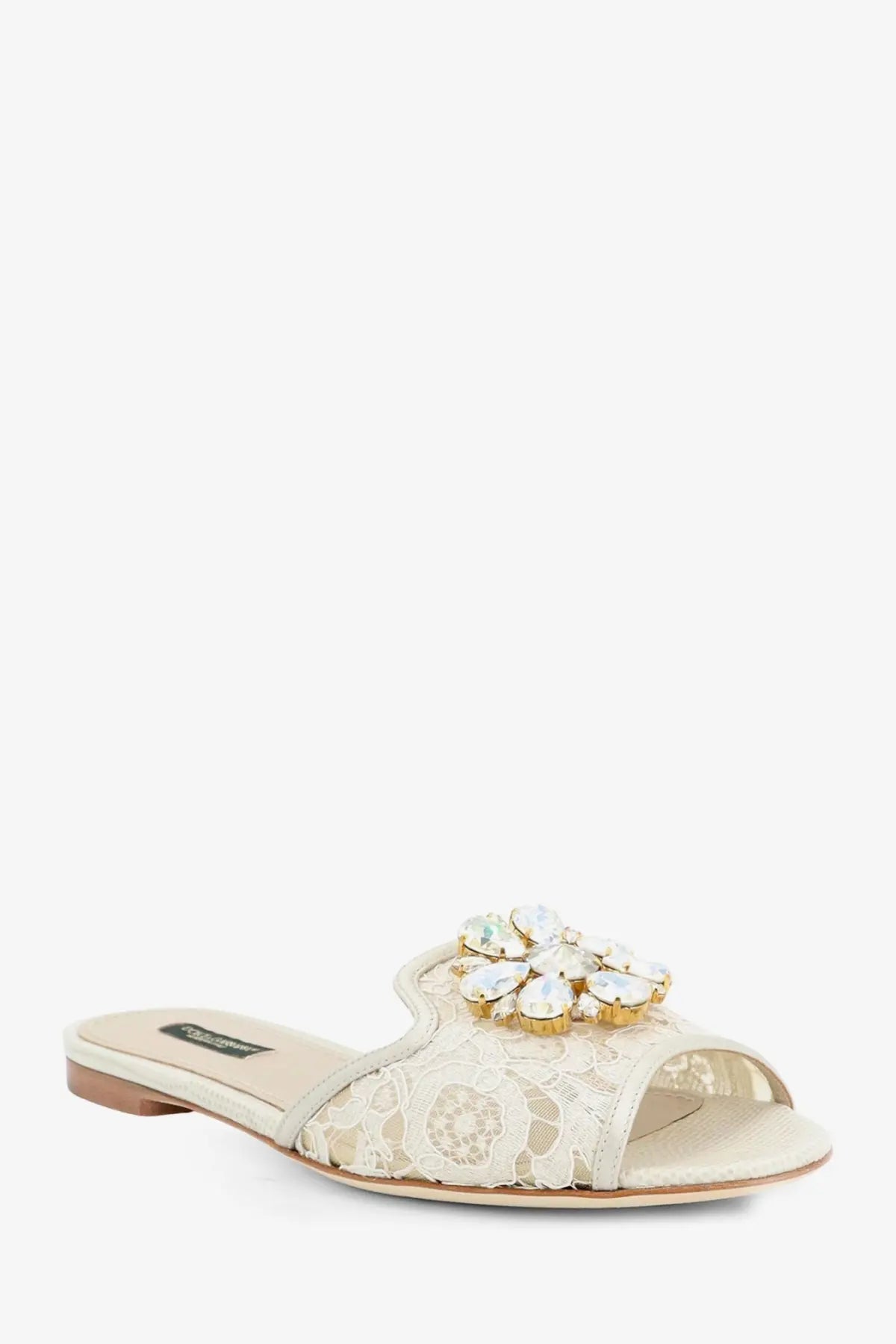 Beige lace slide sandal by Dolce &amp; Gabbana featuring a sparkling crystal flower embellishment in ghiaccio color