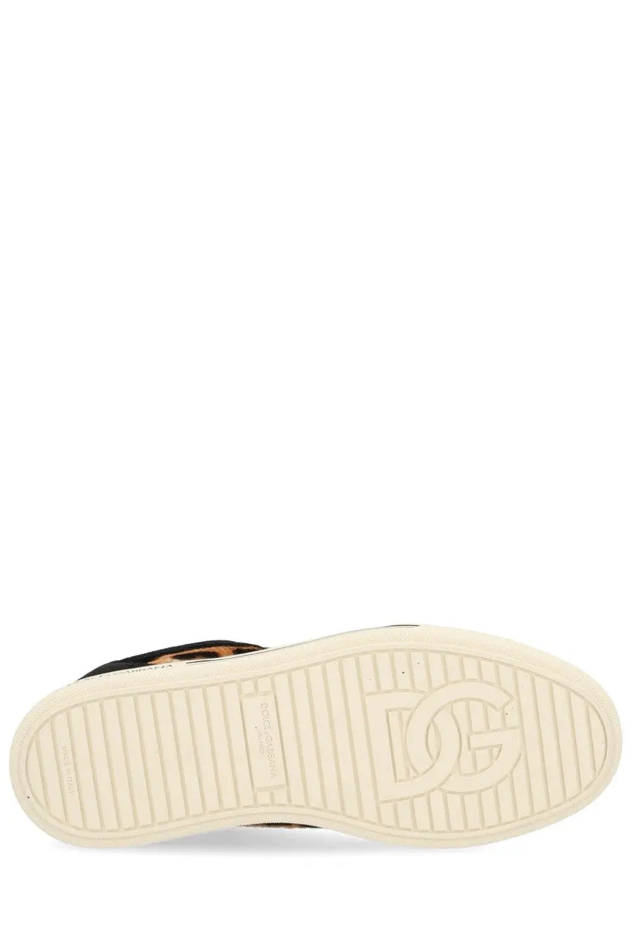 Cream-colored rubber sole with embossed dg logo and textured grip on dolce and gabbana women’s saint tropez sneaker