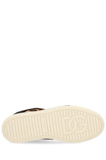 Cream-colored rubber sole with embossed dg logo and textured grip on dolce and gabbana women’s saint tropez sneaker
