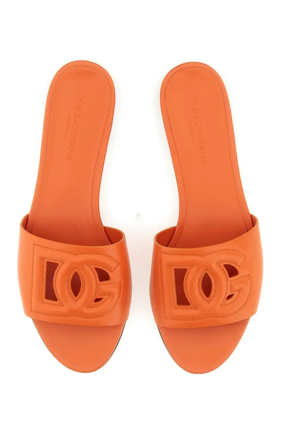 Dolce &amp; Gabbana women’s orange leather slide sandals with a prominent embossed dc logo on the strap