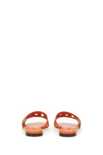 Dolce &amp; Gabbana women’s Sandalo slide with orange leather upper and black rubber soles in minimalist design