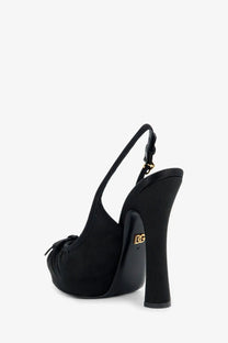 Dolce &amp; Gabbana women’s black satin slingback pump with glossy finish and gold-tone logo plaque on the heel back side