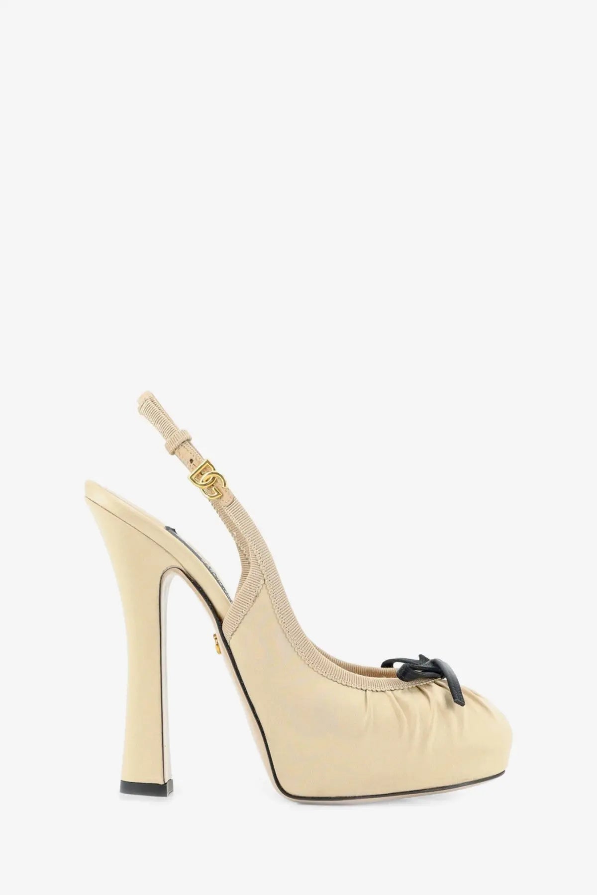 Beige dolce and gabbana women’s satin slingback pump with black bow and gold-tone hardware at the toe