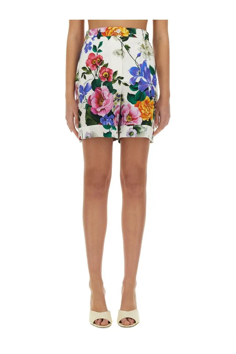Dolce &amp; Gabbana women’s multicolor floral print mini skirt in white fabric with pink blue yellow blossoms and green leaves