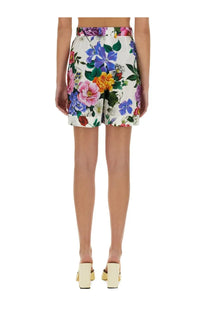 Dolce &amp; Gabbana women’s white shorts with multicolor vibrant blue pink yellow and purple floral print on light fabric