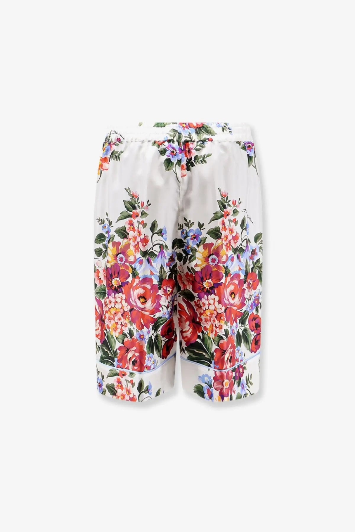 Dolce &amp; Gabbana women’s white silk shorts with a vibrant full-length floral pattern in red orange and purple
