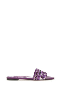 Dolce &amp; Gabbana women’s purple slide sandal with patterned strap featuring brand logo and ornate designs