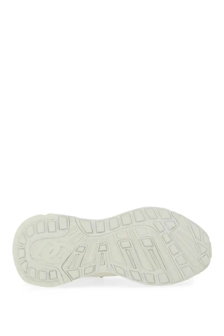 Dolce &amp; Gabbana women’s sneaker featuring a white rubber sole with a textured geometric tread pattern