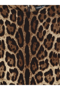 Dolce &amp; Gabbana women’s stretch silk dress in rich brown and black leopard print with brand label at neckline