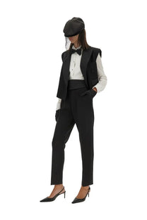 Dolce &amp; gabbana women’s tailored tuxedo pants in black paired with a black satin peak lapel vest with structured shoulders