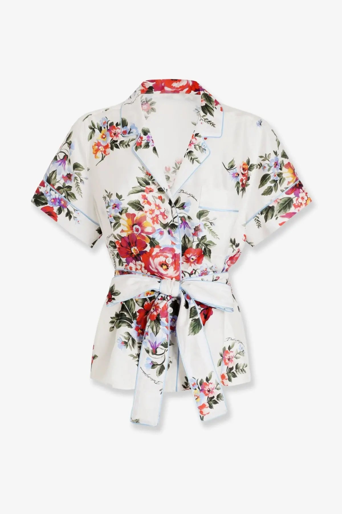 Dolce &amp; Gabbana women’s white silk wrap blouse with vibrant floral pattern and light blue piping on collar and cuffs