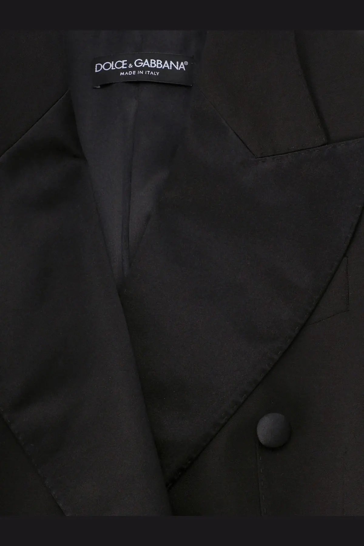 Dolce &amp; Gabbana women’s black virgin wool blend tuxedo blazer with sleek tailored design and subtle sheen