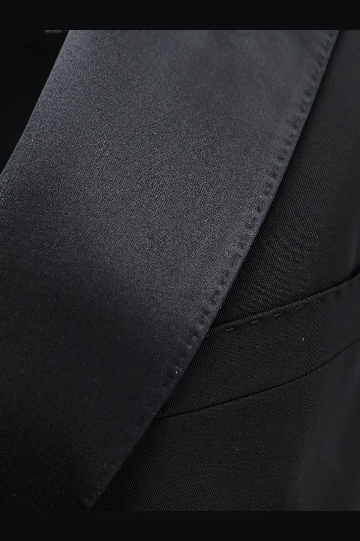 Black satin lapel with precise stitching and glossy finish on Dolce &amp; Gabbana women’s virgin wool and silk tuxedo vest