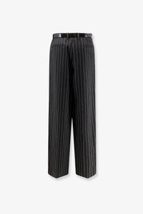 Black pinstripe wide-leg wool and linen blend trousers with sleek tailored fit and matching belt by dolce and gabbana