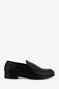 Black woven leather loafer with classic moccasin design and low-profile sole from Doucal’s men’s Adler collection
