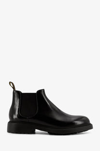Doucal’s men’s black leather chelsea boot with black patent leather, elastic side gussets, and chunky rubber sole