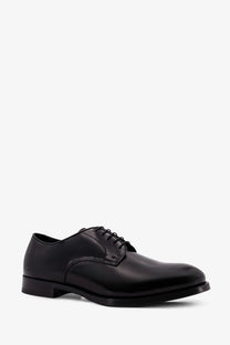 Doucal’s men’s black leather oxford shoe with polished finish and classic lace-up design