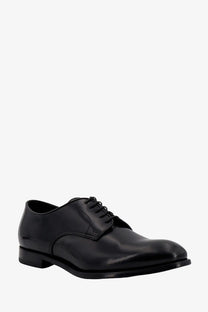 Doucal’s men’s black patent leather oxford shoe with polished finish and classic lace up design