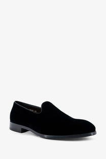 Doucal’s men’s black velvet slip-on loafer with a sleek low-profile heel and smooth black rubber sole