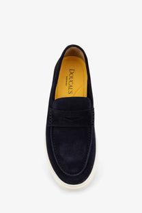 Doucal’s men’s visone blue suede loafers with contrasting white rubber sole and subtle stitching details
