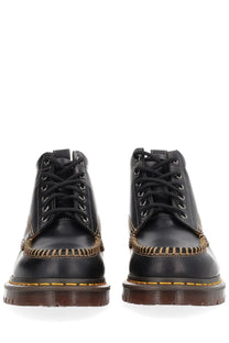 Dr Martens men’s black leather Lowell chukka boot shown from the back side with classic rugged design