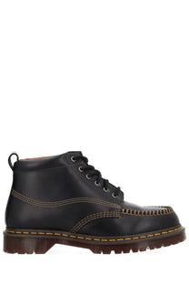 Black leather chukka boot for men by dr martens featuring durable leather and classic design