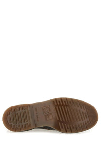 Brown rubber sole with textured tread pattern on dr martens men’s boot vintage black