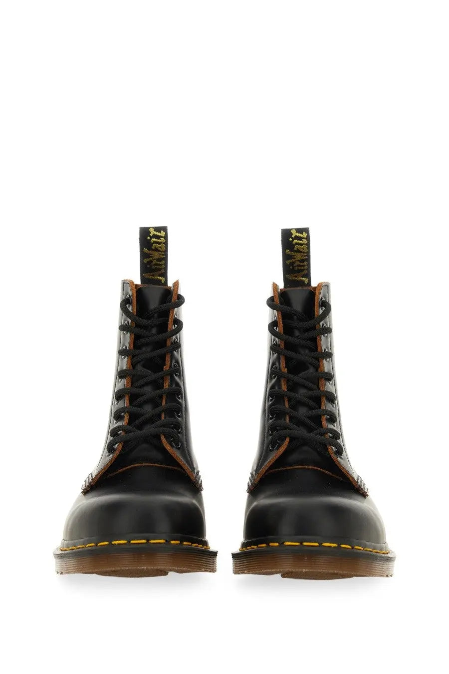Black leather dr martens men’s boot vintage black showing the back side with classic stitching and heel loop